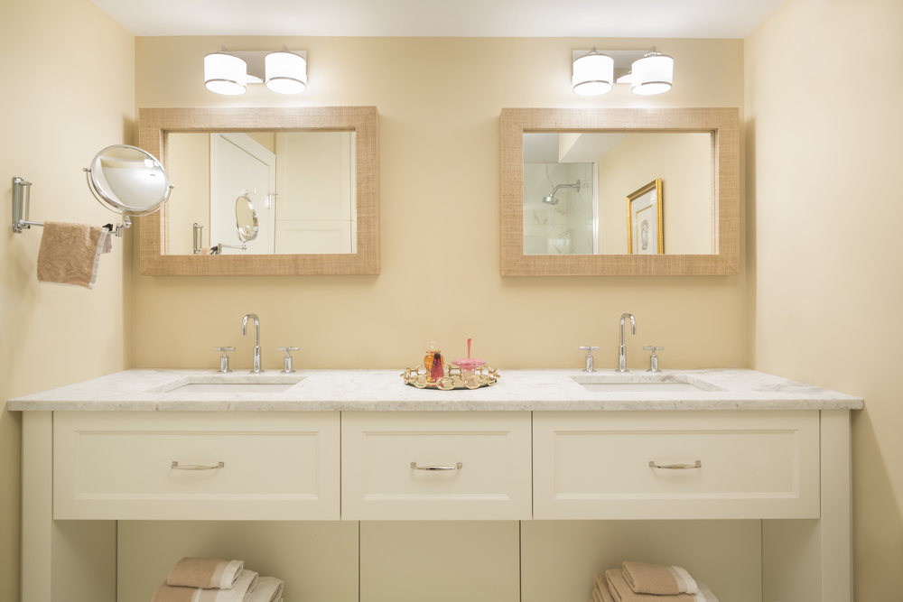 white bathroom vanity with marble countertops